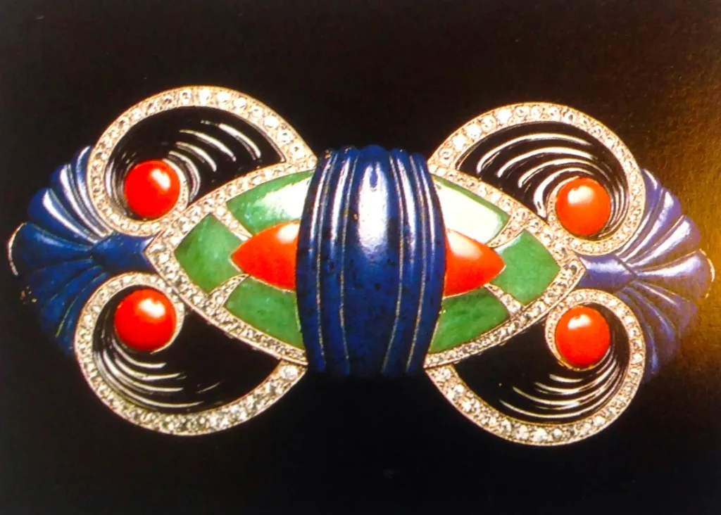 Boucheron - Gold buckle with diamond, carved onyx, lapis lazuli, jade and coral (1925)